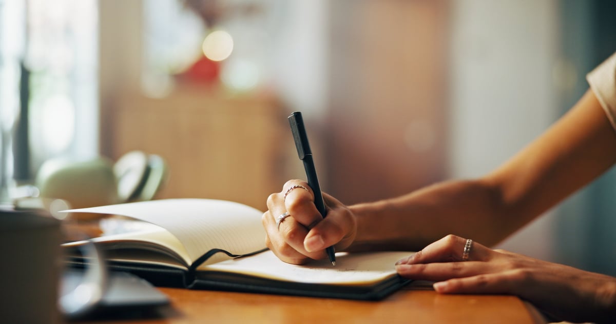 Woman journaling peacefully at home