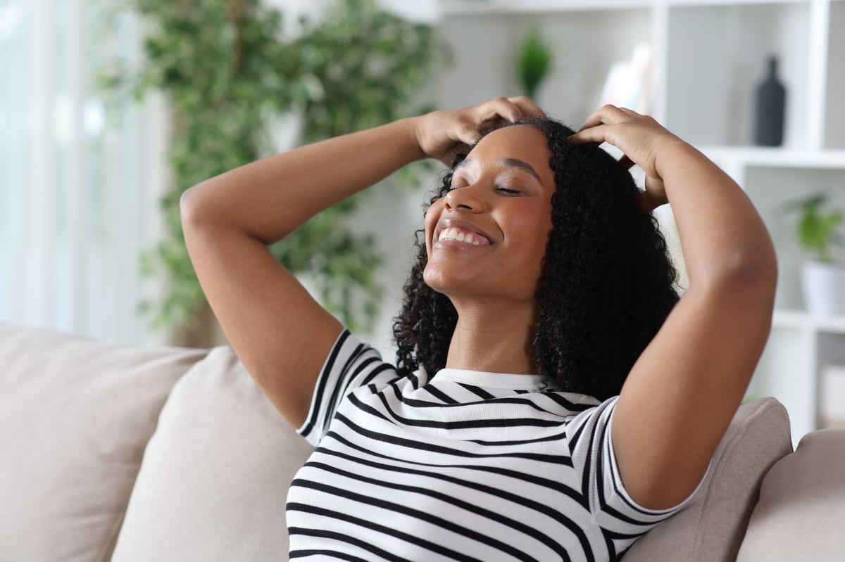 Woman relaxing peacefully at home