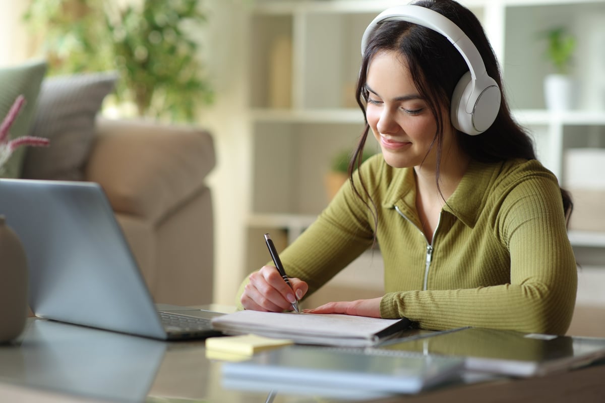 Student learning online with headphones